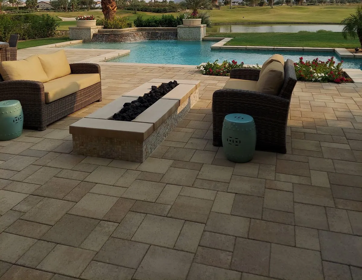 Concrete paver pool deck around a residential pool